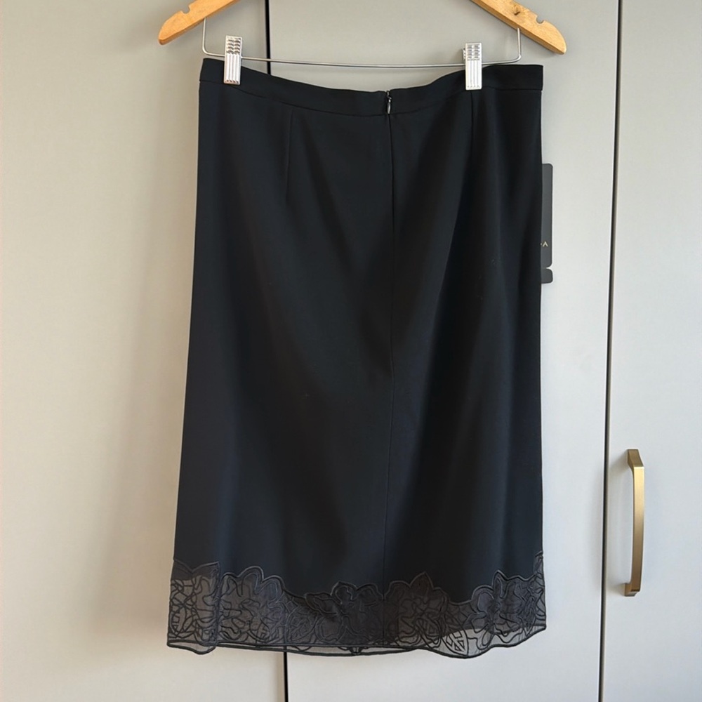 NWT skirt! Perfect for a professional to evening outfit. Never worn.